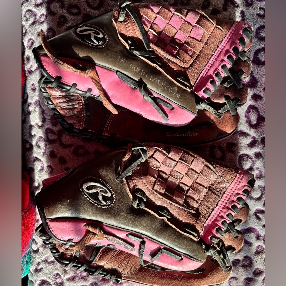 Pink and brown softball mitts
